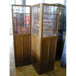 An oak-panelled three-fold draught screen, glazed, H 183cms W 52cms (each panel)...