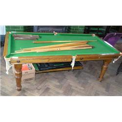 An oak quarter-sized billiard-cum-dining table by E J Riley Ltd, with accessories, L 195cms W 103...