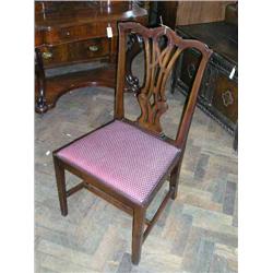 A set of four Chippendale style mahogany dining chairs having pierced vase splats...