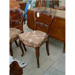 A set of four Victorian rosewood balloon back dining chairs....