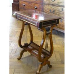 A 19th century French plum pudding mahogany work table, inlaid with cut brass-work, H 71cms W 49c...