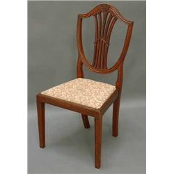 A set of six Hepplewhite style mahogany dining chairs...