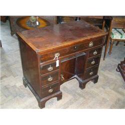 A George III mahogany and cross-banded kneehole desk, H 80cms W 95cms...