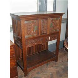 A carved oak side cabinet, H 144.5cms W 122.5cms...