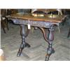 Image 1 : An Irish Victorian carved oak and walnut card table with shaped folding top, H 74cms W 93cms...