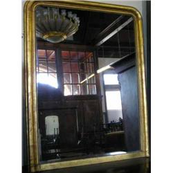 A gilt-framed overmantel mirror, H 138cms W 109cms...