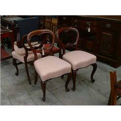 A set of four Victorian mahogany balloon back dining chairs....