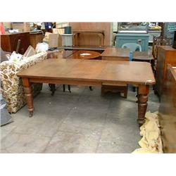 A late Victorian oak extending dining table, L 239cms D 120cms...