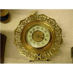 A French brass strut timepiece Dia 19cms...