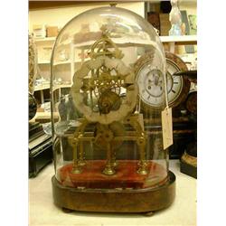 A Victorian brass skeleton timepiece under dome. H 38cms W 25cms...