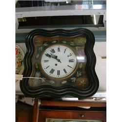 An Italian ebonised wall clock, having eight-day movement, H 48cms W 48cms...