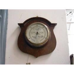 An aneroid barometer by James Walker, H 27cms...