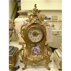 A French rococo style brass mantel timepiece, H 28cms...
