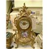 Image 1 : A French rococo style brass mantel timepiece, H 28cms...