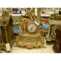 A 19th century French onyx and spelter timepiece, H 32cms, and a similar clock, H 38cms...