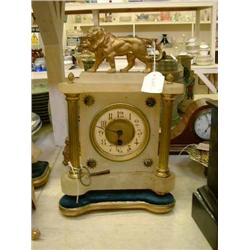 A 19th century French alabaster and spelter mantel timepiece, H 33cms W 23cms, and an oak timepie...