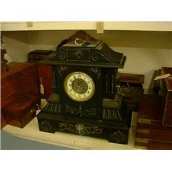 A Victorian black slate and brass-mounted mantel clock, having eight-day movement, H 46cms W 47cm...