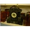 Image 1 : A Victorian black slate and brass-mounted mantel clock, having eight-day movement, H 46cms W 47cm...
