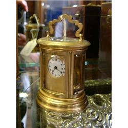 A French brass miniature cylindrical carriage timepiece, H 10cms...