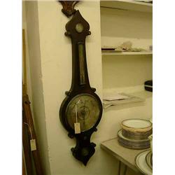 A George IV rosewood wheel barometer, inlaid with mother-of-pearl, H 106cms...