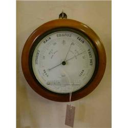 An Edwardian beech circular aneroid barometer, Dia 27cms...
