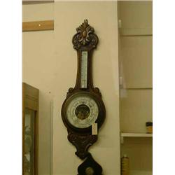 A Victorian oak aneroid barometer, H 90cms...