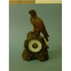 A 19th century Black Forest aneroid barometer, H 39cms W 22cms...