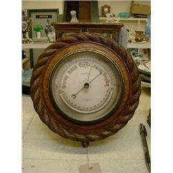 A Victorian oak circular aneroid barometer by Short & Mason Ltd, London, Dia 21cms; and one other...