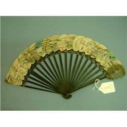 A late 19th century chinoiserie-decorated and lacquered fan, L 23cms...