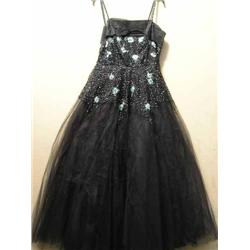 Eight mid-20th century evening gowns and two petticoats....