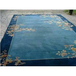 A Chinese blue floral-cut carpet, L 465cms W 323cms...