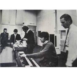 The Beatles at Abbey Road, two rare black and white photographs, 19cms x 24cms...