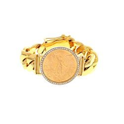 BRACELET: [1] 14 karat yellow gold Cuban chain bracelet set with a Mexican Gold 50 Pesos  (37.5 gram