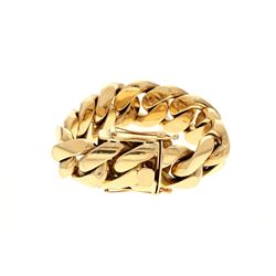 BRACELET: [1] 10kt yellow gold Cuban link bracelet; 8.5 inches long x 1 inch wide, double safety cla