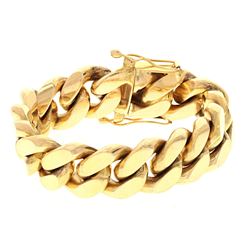 BRACELET: [1] 14ky stamped Cuban link bracelet, 8.5 inches long, 20.83mm wide; 275.4 grams.