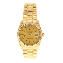 ROLEX: 18 karat yellow gold Rolex Oyster Perpetual DayDate President watch, 36mm case, gold dial wit