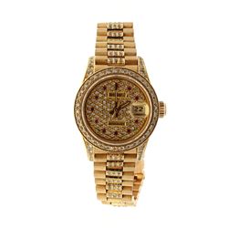 WATCH: [1] Lady's 14KYG date wristwatch with Rolex movement ;SN #2369276, movement #2235, diamond di
