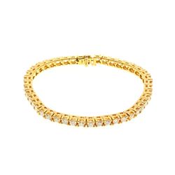 BRACELET: [1] 14 karat yellow gold tennis style bracelet set with 45 round diamonds, approx. 6.75 ca