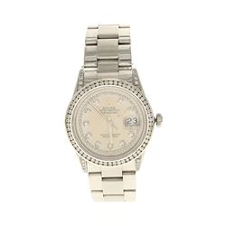 ROLEX: St.steel Rolex Oyster Perpetual DateJust watch, 36mm case, champagne dial with diamond accent