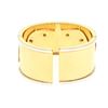 Image 2 : BRACELET: [1] 18 karat yellow and white gold hinged cuff style bangle bracelet with elephants and se