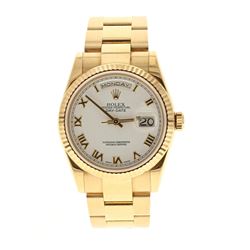 ROLEX: 18k yellow gold Rolex DayDate President; 36mm case, white dial with roman numerals, fluted be