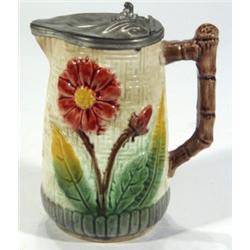 Majolica jug with branch handle, relief mo…