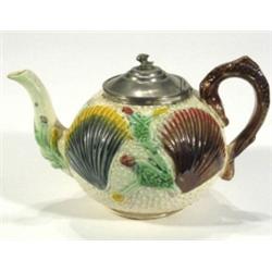 Majolica teapot, relief moulded with shell…
