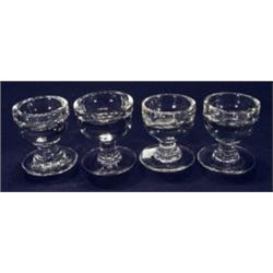 Four clear slammer glasses, 7cm high…