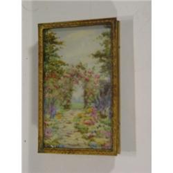 Brass framed painting onto ivory of a cott…