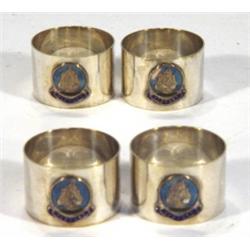Set of four silver plated napkin rings wit…