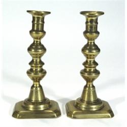 Two pairs of Victorian brass candlesticks,…