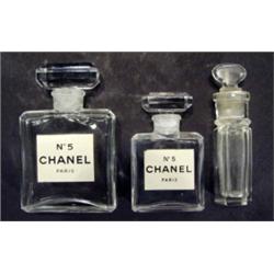 Two cut glass Chanel perfume bottles and o…
