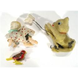 Three clockwork toys - a cat chasing a but…