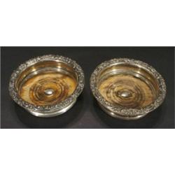 Pair of silver plated wine coasters with w…